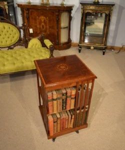 A MAHOGANY INLAID EDWARDIAN PERIOD ANTIQUE REVOLVING BOOKCASE